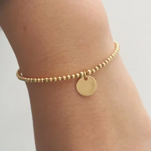 bracelet billes et médaille- plaqué or